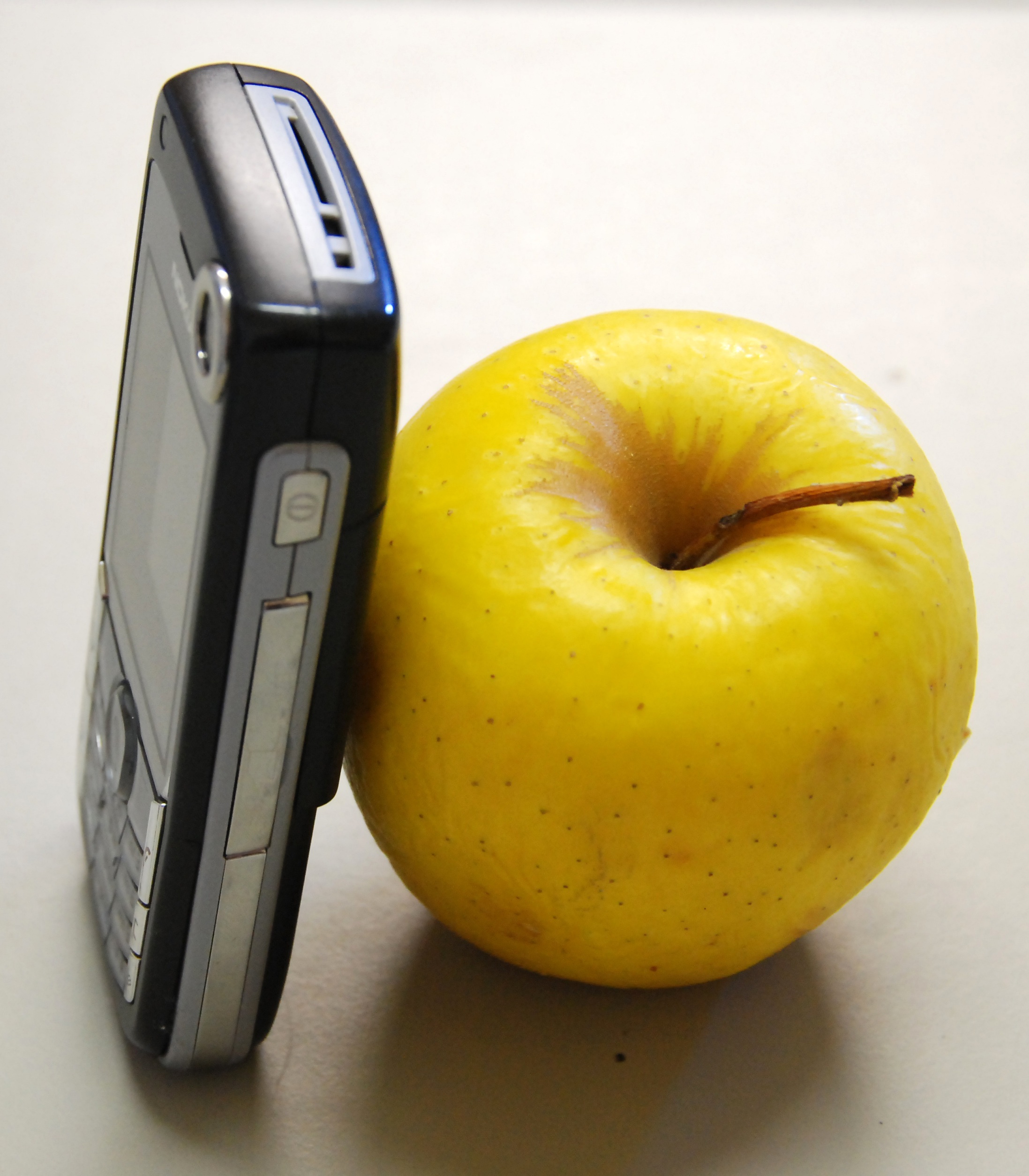 apple with cell phone