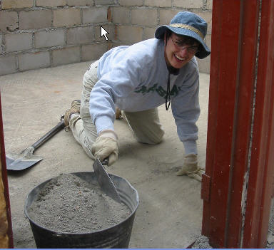 Kristine working on hands and knees inside the habitat house