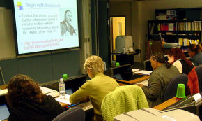 Workshop participants viewing an AT Writing Presentation