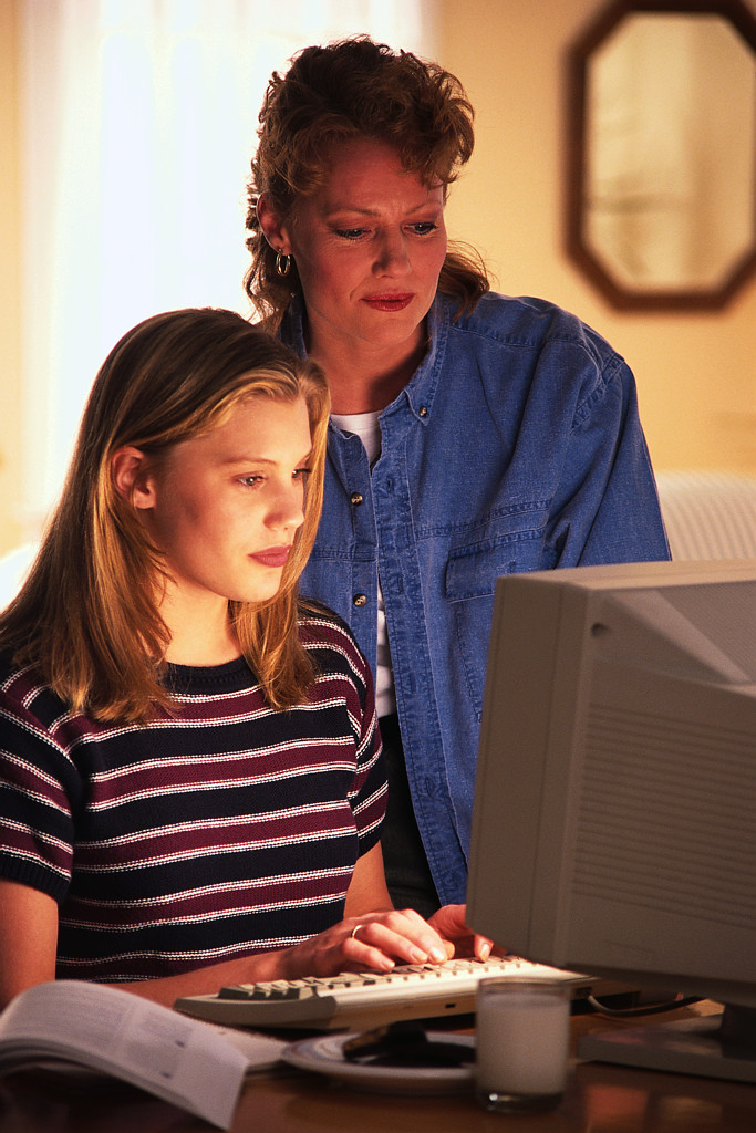 Image of mother and daughter at computer