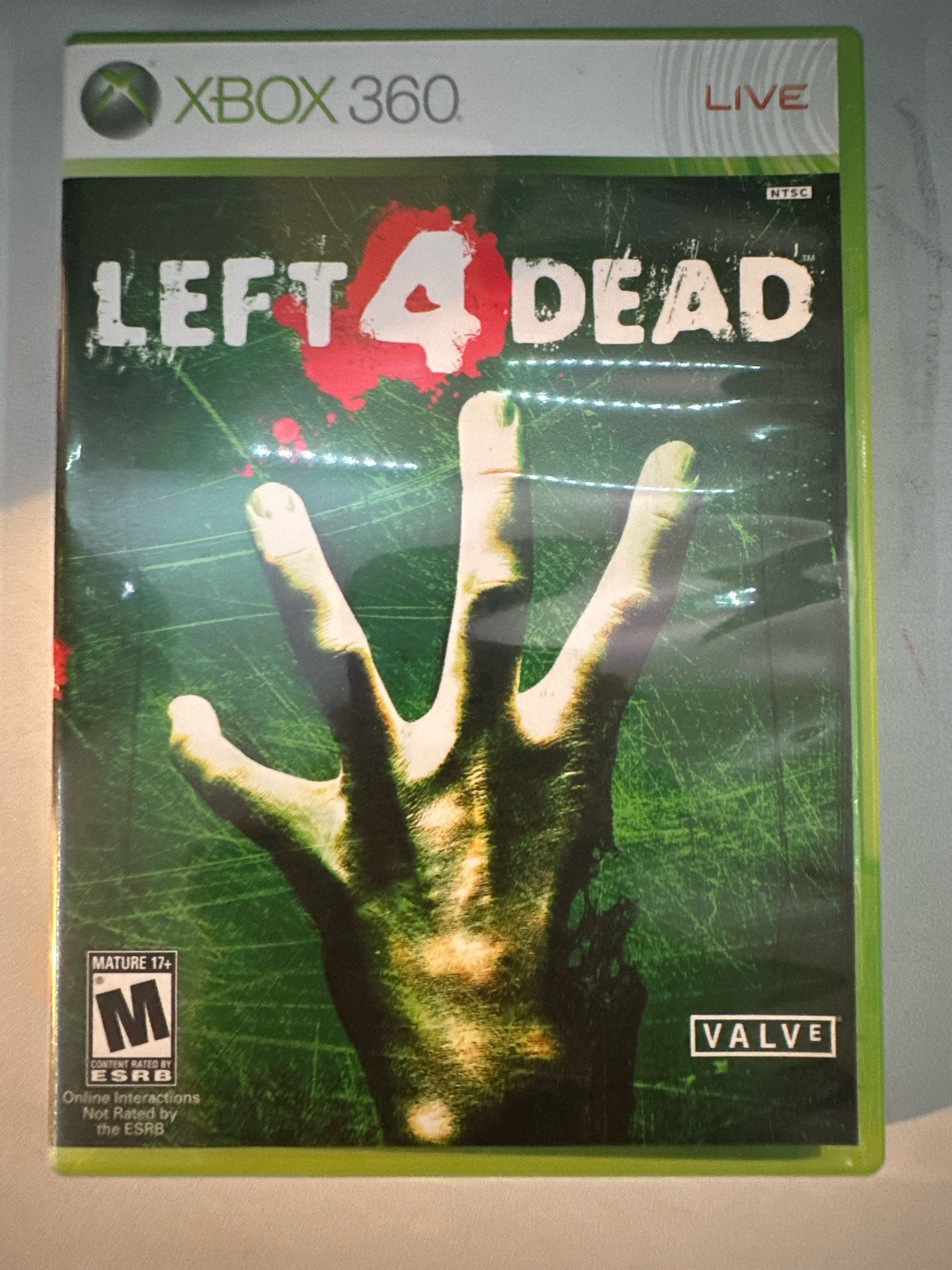 Picture of my own copy of Left 4 Dead Xbox 360. Taken by Abyan Ahmed, 4 Apr. 2025. iPhone 14 Pro. © Abyan Ahmed, 2025. CC BY-NC 4.0.