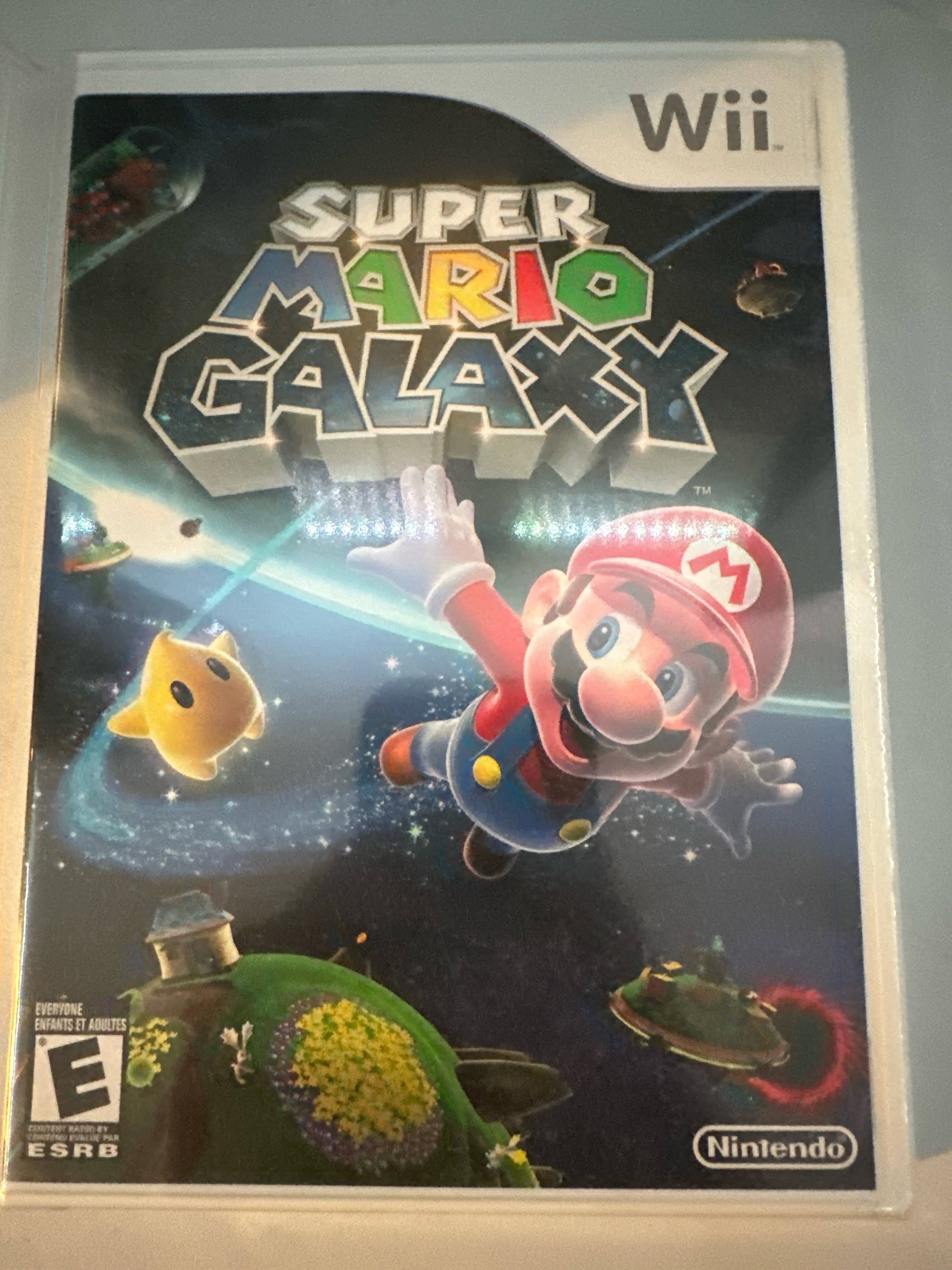 Picture of my own copy of Super Mario Galaxy Wii. Taken by Abyan Ahmed, 4 Apr. 2025. iPhone 14 Pro. © Abyan Ahmed, 2025. CC BY-NC 4.0.