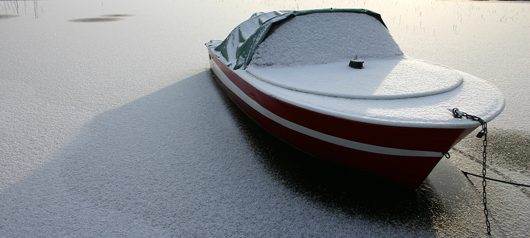 https://stock.adobe.com/images/bow-part-of-fishing-motor-boat-in-the-snow-winter-navigation-and-outdoor-storage-of-watercrafts-on-the-water-at-the-pier-side-view/237790392