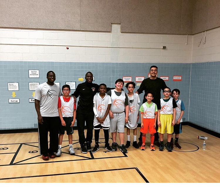 Players coached elementary school kids in basketball
