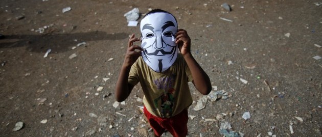 child with terrorist mask