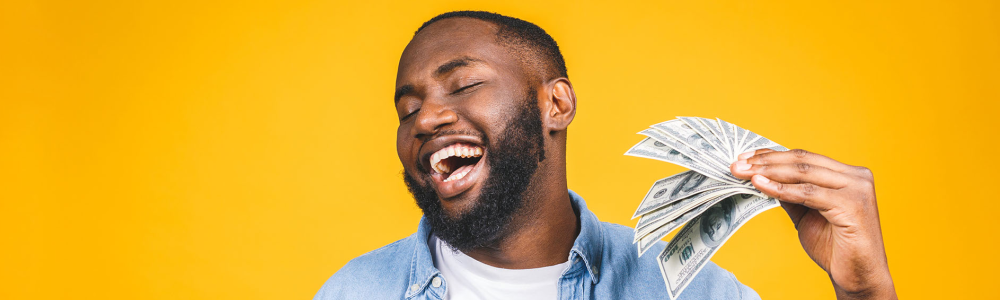 man fanning himself with money