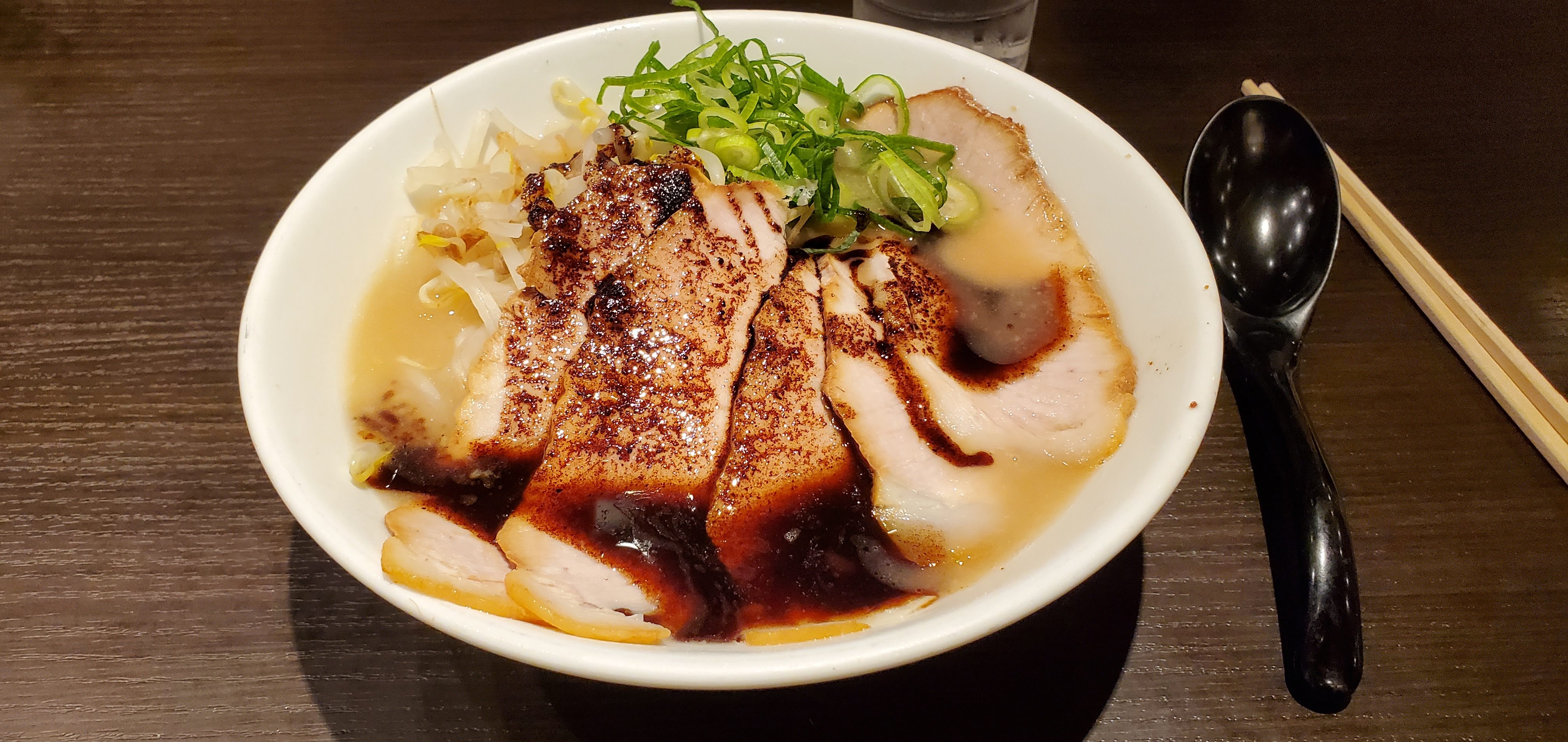 Bowl of Ramen noodles with Chasu Pork and scallions