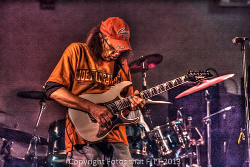 Joe Peets playing the guitar