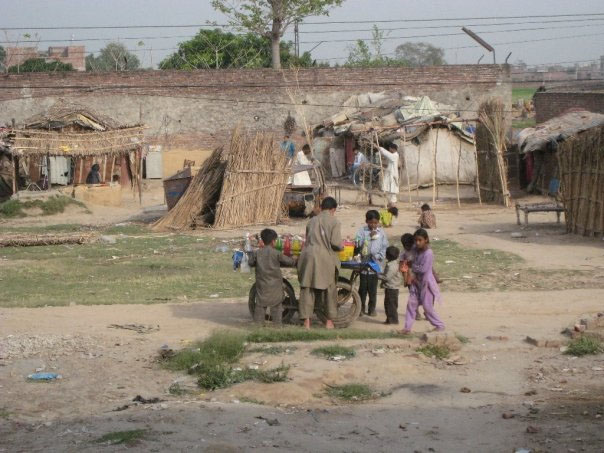 A Group of children playing in a foregin place in a far off place.